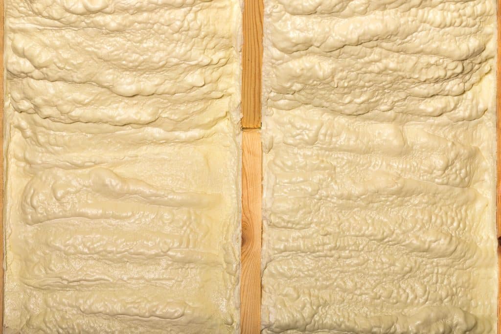 Expressive texture of building yellow foam on the wall.